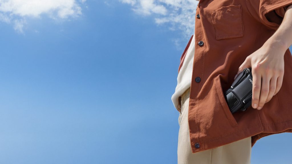 A person keeping the Ruko U11Mini 4K in their pocket